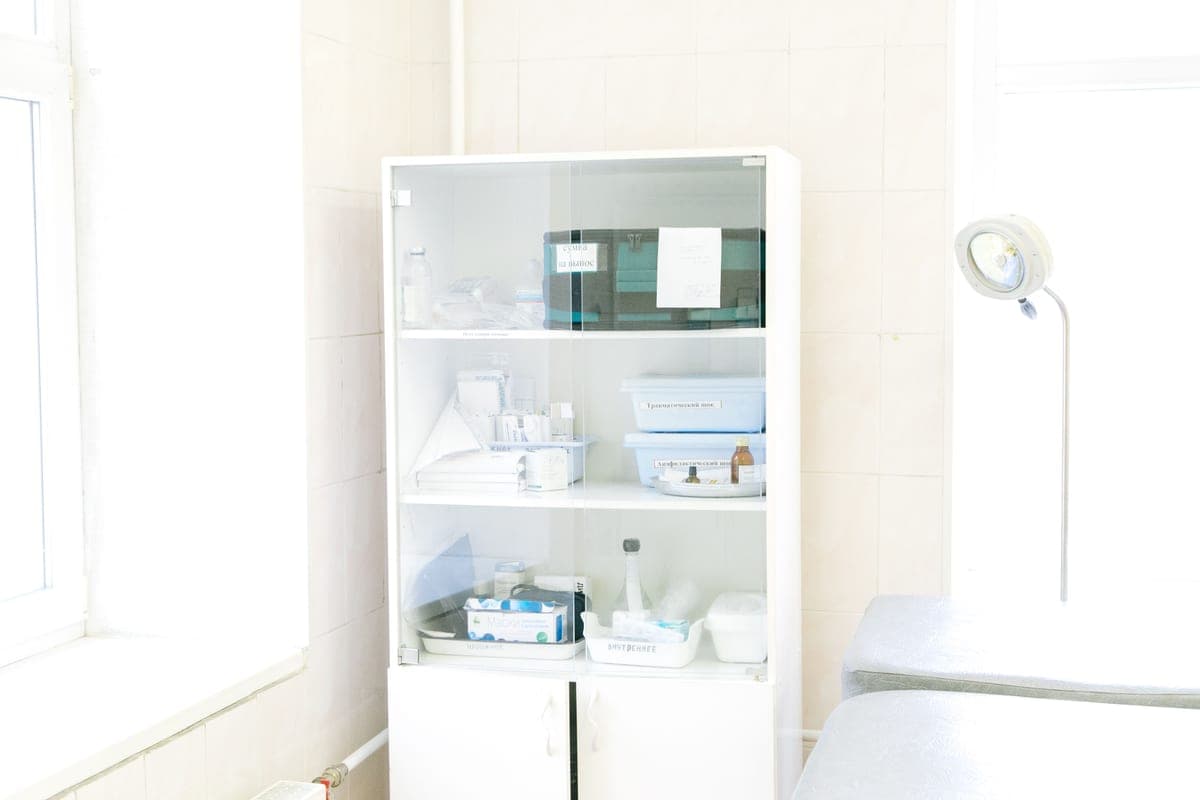 A cabinet-style storage unit with doors and shelves in a living space