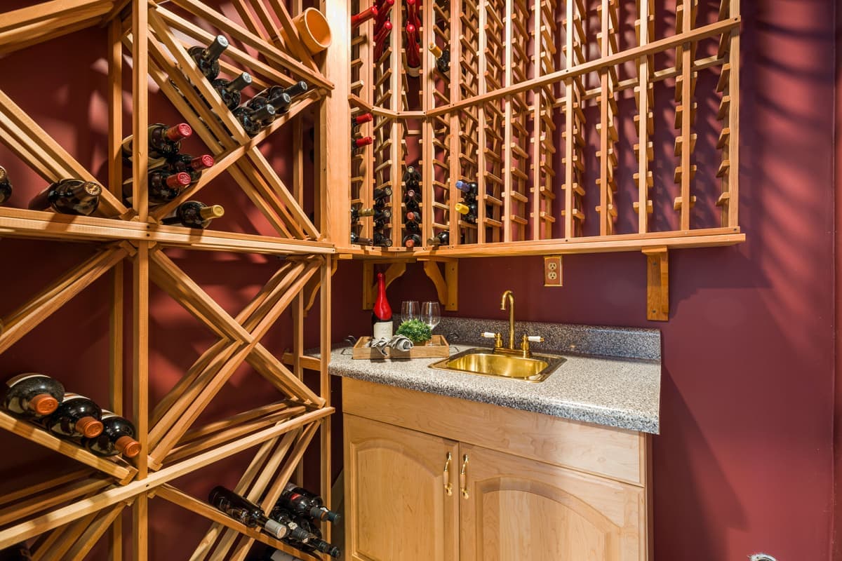 Wine bottles stored horizontally in a wooden rack