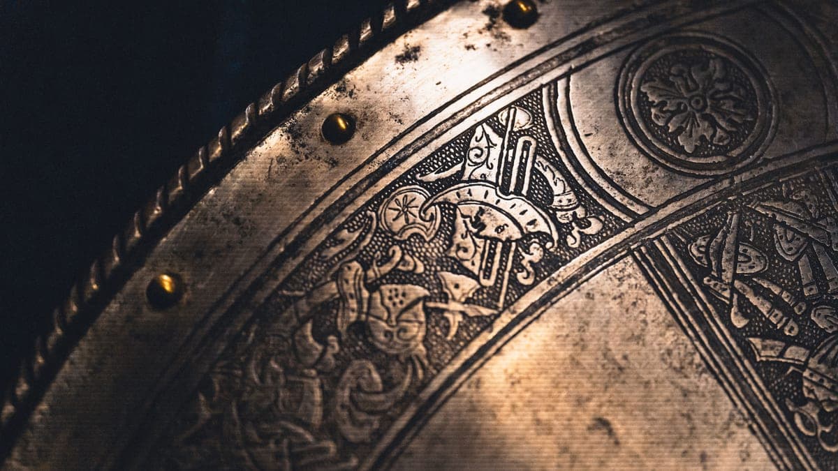 A close view of a warm brass metal surface catching side light