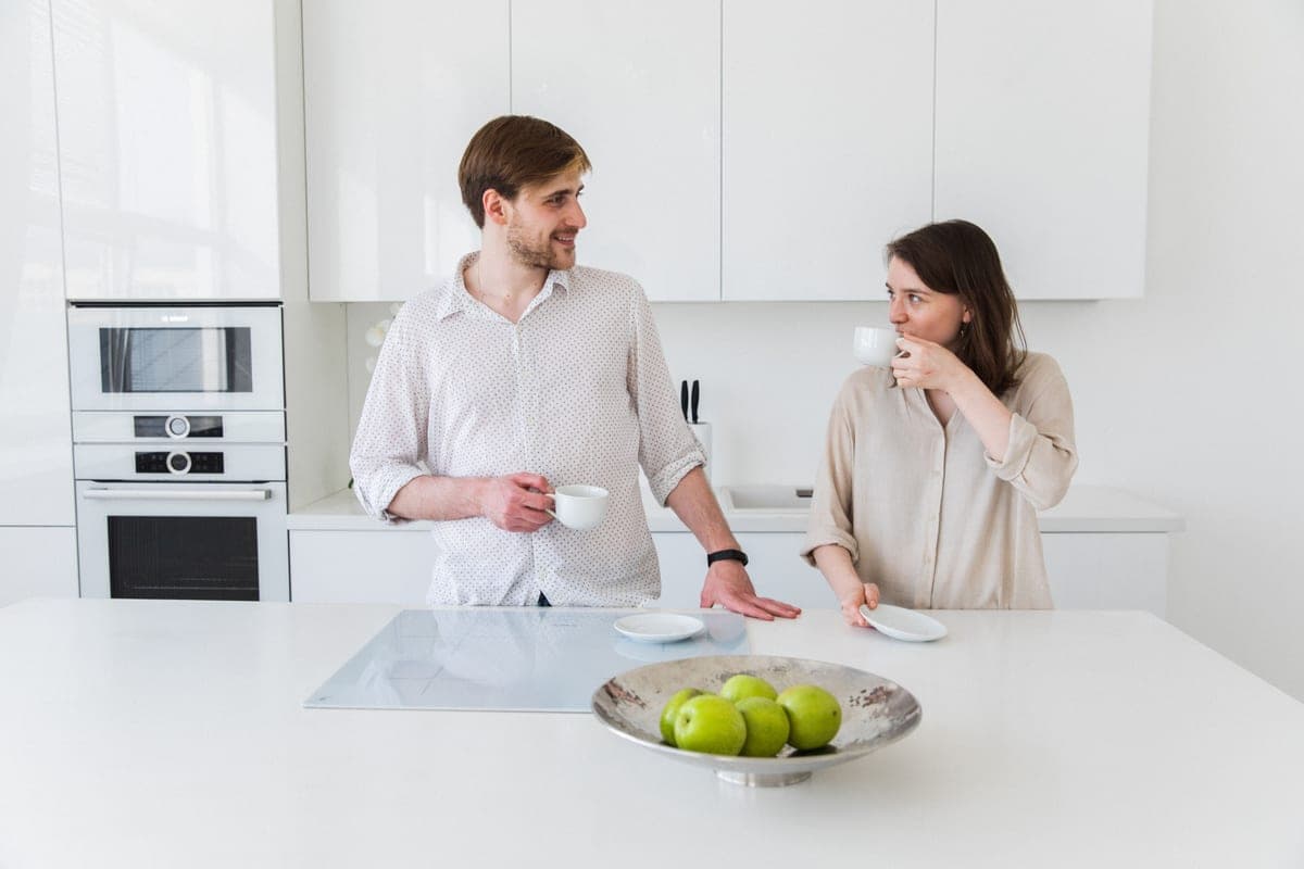 A kitchen counter and a lower table surface shown together for height comparison