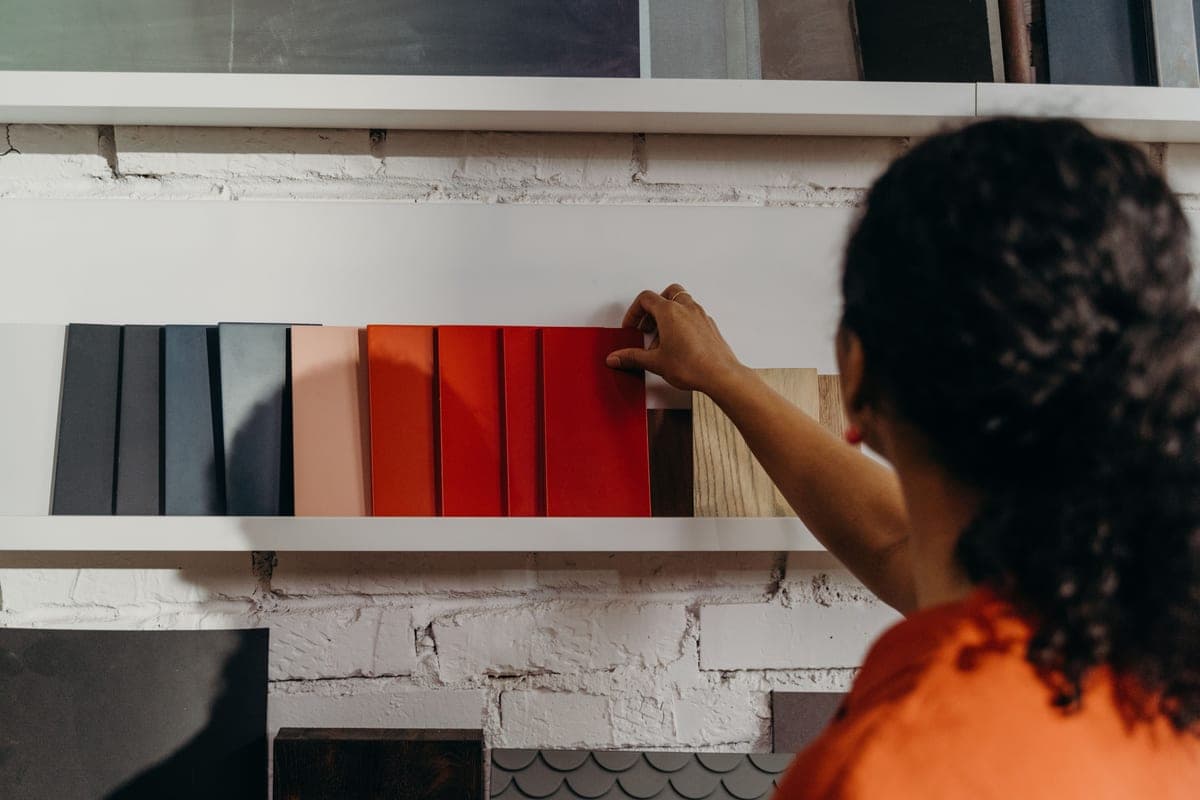 Metal and wood finish samples laid out on a work surface