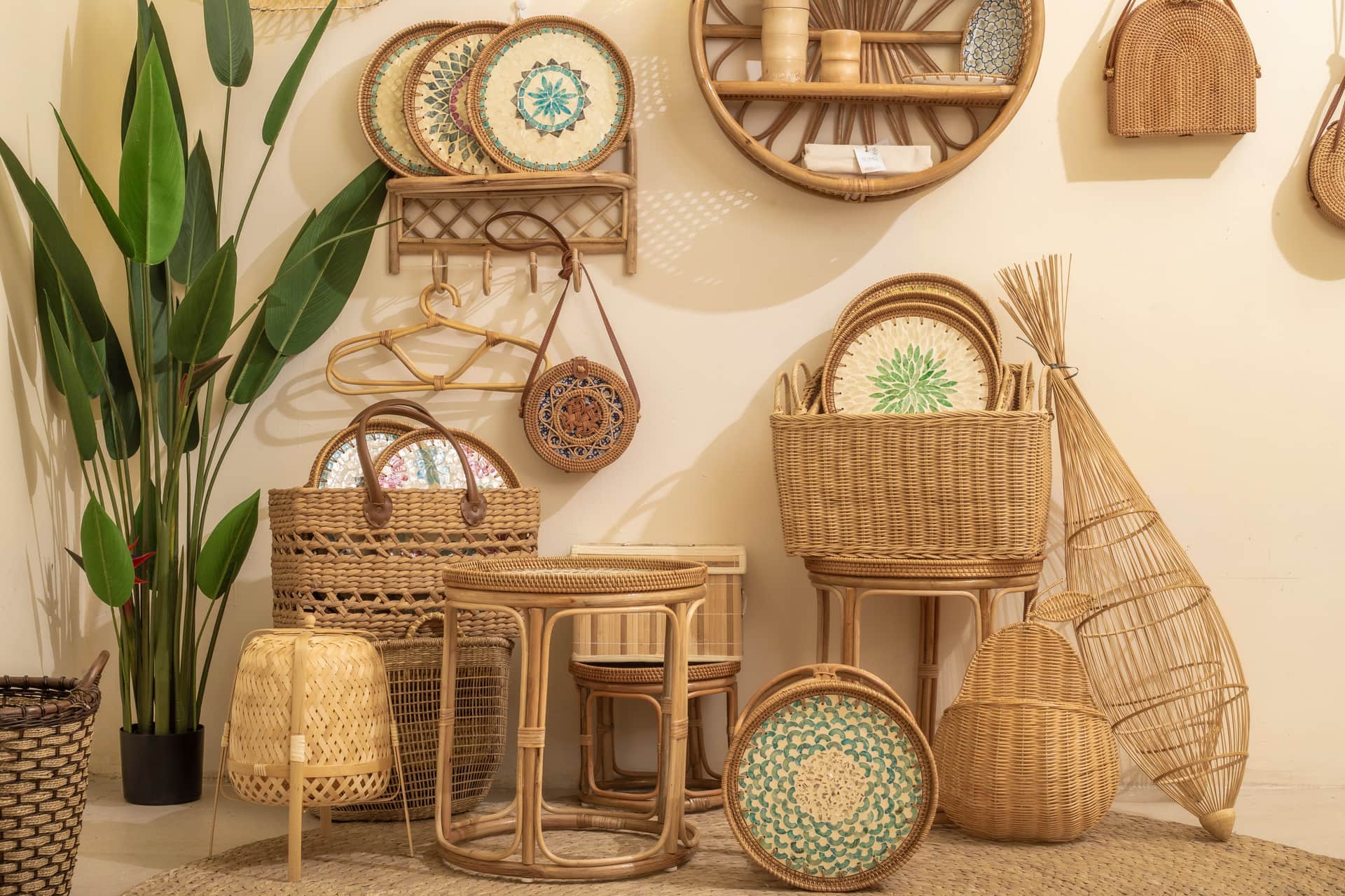 Wicker and rattan furniture arranged with greenery in a bright indoor room